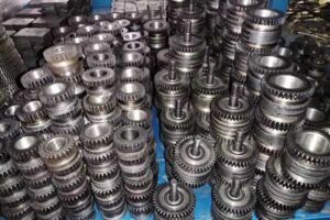 Stitching machine feed wire wheel